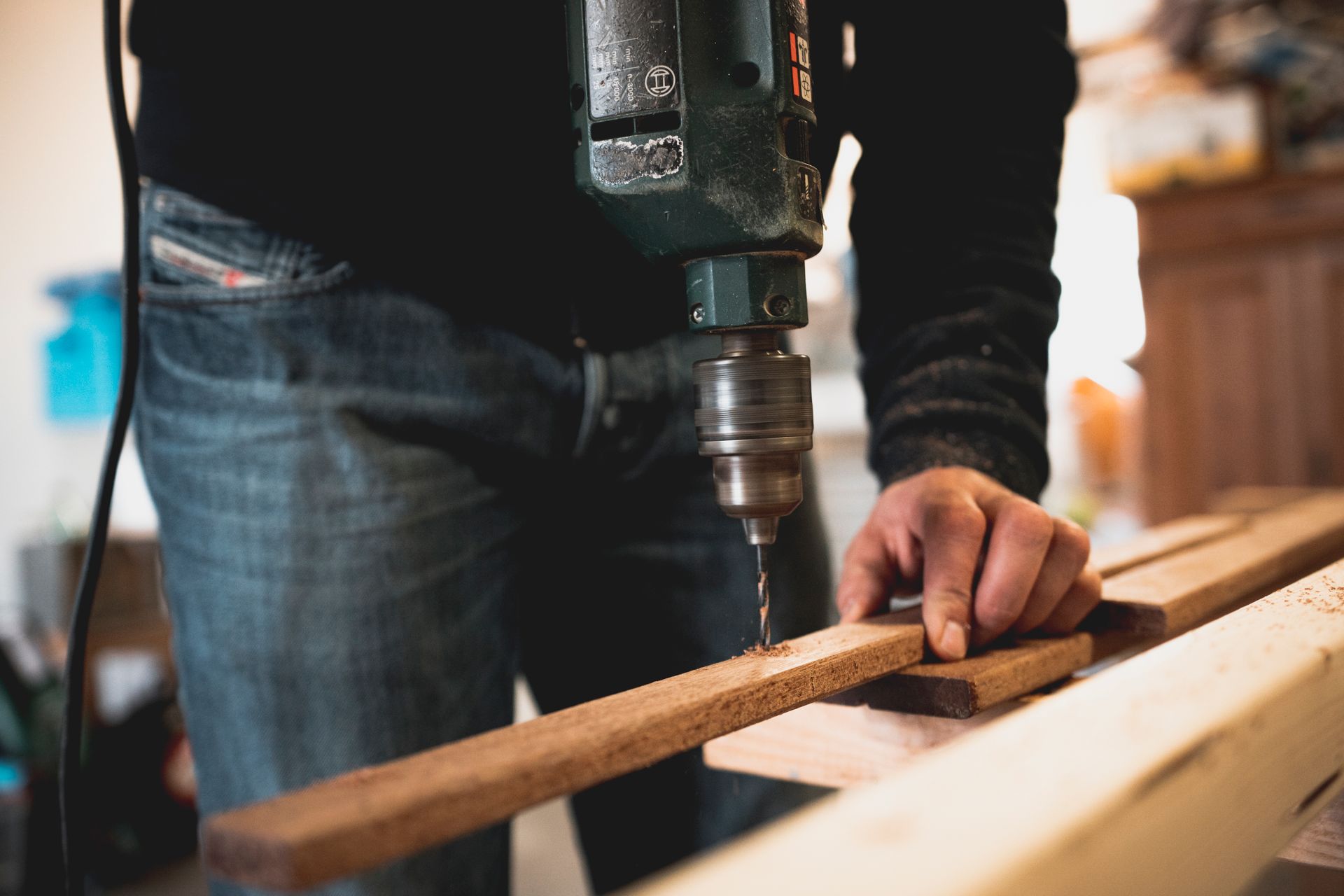 Woodworking a furniture piece in a workshop