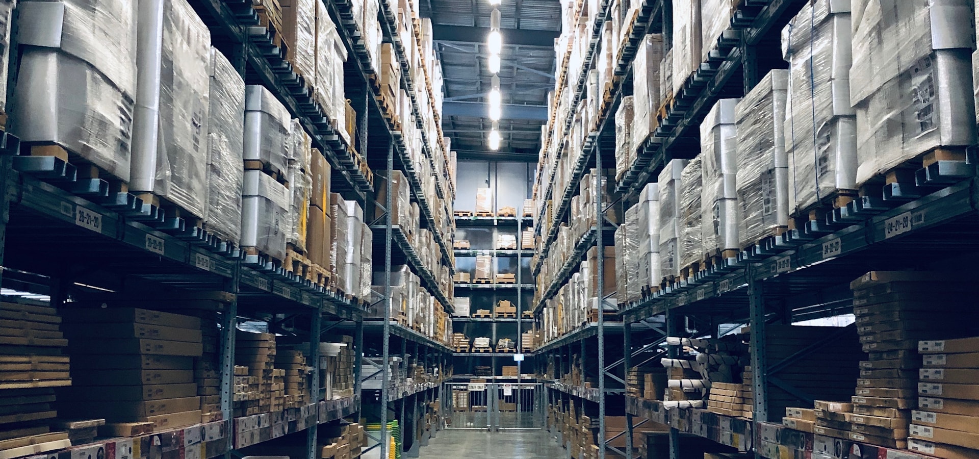 Packaged goods stored in a warehouse aisle
