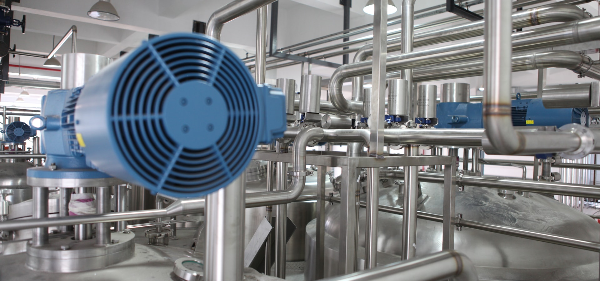 Stainless steel tanks and piping in a chemical processing plant